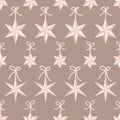 Vector seamless pattern with pink origami star Christmas ornaments hanging on ribbons with bows on taupe background. Fun Royalty Free Stock Photo