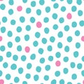 Vector seamless pattern with randomly placed pink and mint hand drawn polka dots on a white background