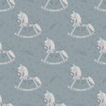 Vector seamless pattern with retro rocking kids toy blue horse with branches and decoration of hearts.