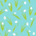 Vector seamless pattern. Snowdrop flowers on a blue background. Spring background. Royalty Free Stock Photo