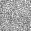 Vector seamless pattern with tiny black round scribbles hand painted with ink on white background. Vintage monochrome