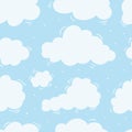 Vector seamless pattern white cartoon clouds on a blue sky background. Royalty Free Stock Photo