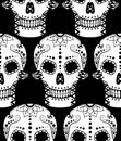 Vector seamless pattern of white sugar skull with ethnic ornament on black background Royalty Free Stock Photo