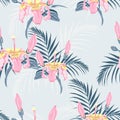 Vector seamless tropical pattern, vivid tropic foliage, with palm leaves, tropical pink hibiscus flower in bloom. Royalty Free Stock Photo