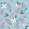 Vector seamless winter pattern with red berries, leaves, cotton flowers, christmas candies and snowflakes on the blue background. Royalty Free Stock Photo