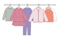Vector set of baby girl and baby boy clothes on a hanger. Pink dress and blue romper. Isolated on white background Royalty Free Stock Photo