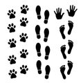 Vector set of black footprints of humans and animals. Royalty Free Stock Photo