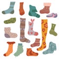 Vector set of flat hand drawn warm socks. Collection of knitted clothes with decoration for stickers. Stockings and golfs