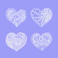 Vector set of four doodle hand drawn white hearts