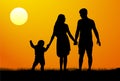 Vector silhouette of a family at sunset. Man woman child at dawn