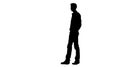 Vector silhouette of a man in a business suit standing, black color isolated on white background Royalty Free Stock Photo