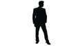 Vector silhouette of a man in a business suit standing, black color isolated on white background Royalty Free Stock Photo