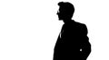 Vector silhouette of a man in a business suit standing, black color isolated on white background Royalty Free Stock Photo