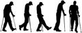 Vector silhouettes of people with crutches.