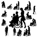 Vector silhouettes of people in a wheelchair. Royalty Free Stock Photo