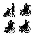 Vector silhouettes of people in a wheelchair. Royalty Free Stock Photo