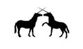 Vector silhouettes of two playing unicorns