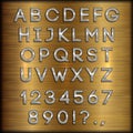 Vector silver coated alphabet letters, digits and punctuation on copper brushed background Royalty Free Stock Photo