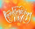 Vector thanksgiving day greeting lettering phrase - happy thanksgiving day - on blur autumn background with flares