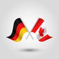 Vector two crossed german and canadian flags on silver sticks