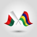 Crossed malagasy and mauritian flags on silver sticks - symbol of madagscar and republic of mauritius Royalty Free Stock Photo