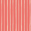 Vector vertical white grunge stripes painted with a brush as a seamless vector pattern on living coral background. Royalty Free Stock Photo