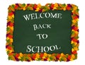 Vector welcome back to school lettering on chalkboard with autumn leaves frame. Isolated on white. Royalty Free Stock Photo