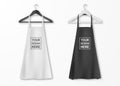 Vector white and black cotton kitchen apron set with clothes hangers closeup isolated on white background. Design Royalty Free Stock Photo