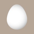 Vector white Easter egg with sunlight isolated on a beige background