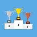 Vector winners podium with gold, silver and bronze trophy cups or awards. Royalty Free Stock Photo