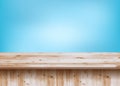 Vector wooden deck table top on blurred blue clean background