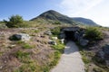 Vedahaugane resting point rest stop area. Entrance to underground cave with artificial bear den. National Tourist Route Royalty Free Stock Photo