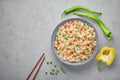 Veg Fried Rice in gray bowl on concrete table top. Veg Fried rice is indo chinese cuisine dish. Indian vegetarian meal Royalty Free Stock Photo