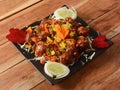 Veg Manchurian, Popular indo-chinese food made of cauliflower florets and other vegetable, served in a black plate over a rustic Royalty Free Stock Photo