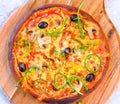 Italian Vegetarian pizza on round wooden board