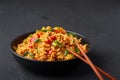 Veg Schezwan Fried Rice in black bowl at dark slate background. indo-chinese cuisine dish Royalty Free Stock Photo