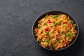 Veg Schezwan Fried Rice in black bowl at dark slate background. indo-chinese cuisine dish Royalty Free Stock Photo