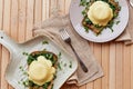 Vegan alternative eggs benedict with plant-based sauce, sourdough bread, tofu, young onion, greens, pea sprout. Healthy Royalty Free Stock Photo