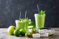 Vegan antioxidant green smoothie, organic cocktail with fresh kiwi fruit, apple, lime and mint, healthy food, vegetarian detox die Royalty Free Stock Photo