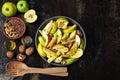 Vegan apple salad in a bowl. Healthy salad with apples, walnuts, spices and flax seeds Royalty Free Stock Photo