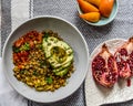 Vegan Avocado Lentil Bowl colorful flat lay, top down composition