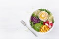 Vegan avocado sweet corn lunch bowl with hummus, red cabbage, radish and sprouts Royalty Free Stock Photo