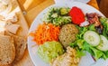 Vegan brunch in cafe, salad, soup and bread as healthy meal