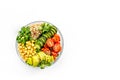 Vegan Buddha bowl. Avocado, quinoa, tomato, spinach and chickpeas vegetables salad on white table top-down copy space Royalty Free Stock Photo