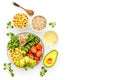 Vegan Buddha bowl. Avocado, quinoa, tomato, spinach and chickpeas vegetables salad on white table top-down copy space Royalty Free Stock Photo