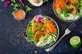 Vegan buddha bowl dinner food table. Healthy food. Healthy vegan lunch bowl. Fritter with lentils and radish, avocado, carrot sala Royalty Free Stock Photo