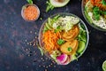 Vegan buddha bowl dinner food table. Healthy food. Healthy vegan lunch bowl. Fritter with lentils and radish, avocado, carrot sala Royalty Free Stock Photo