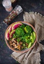 Vegan buddha bowl dinner food table. Healthy food. Healthy vegan lunch bowl. Grilled mushrooms, broccoli, radish salad. Flat lay. Royalty Free Stock Photo