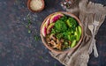 Vegan buddha bowl dinner food table. Healthy food. Healthy vegan lunch bowl. Grilled mushrooms, broccoli, radish salad. Flat lay. Royalty Free Stock Photo