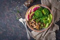 Vegan buddha bowl dinner food table. Healthy food. Healthy vegan lunch bowl. Grilled mushrooms, broccoli, radish salad. Flat lay. Royalty Free Stock Photo